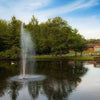 Image of Scott 1HP Pond Fountain Gusher Pattern by Scott Aerator Operating in a Pond with Trees at the Back 13514