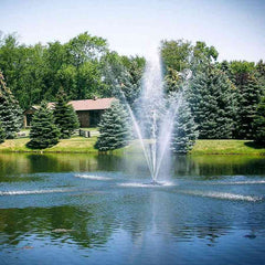 Scott 1-1/2HP Pond Fountain Clover Pattern by Scott Aerator Operating in a Pond with Trees at the Back 13002