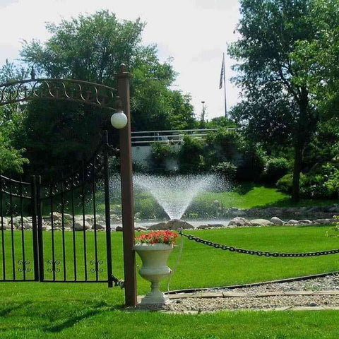 Kasco 1HP Aerating Fountain 4400VFX with V-Shape Pattern Operating in a Pond Surrounded by Plants  115V/230V