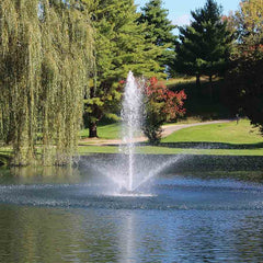 Kasco 3/4HP Decorative Fountain 3400JF with Linden Pattern Operating in a Pond with Trees at the Back 115V/230V